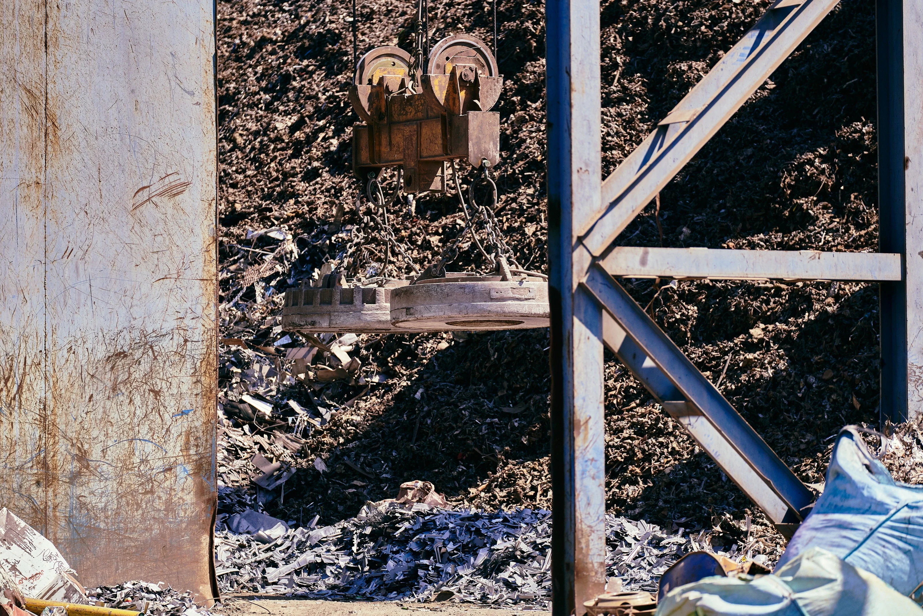 Metal recycling facility with a magnetic crane — illustrative sector photograph